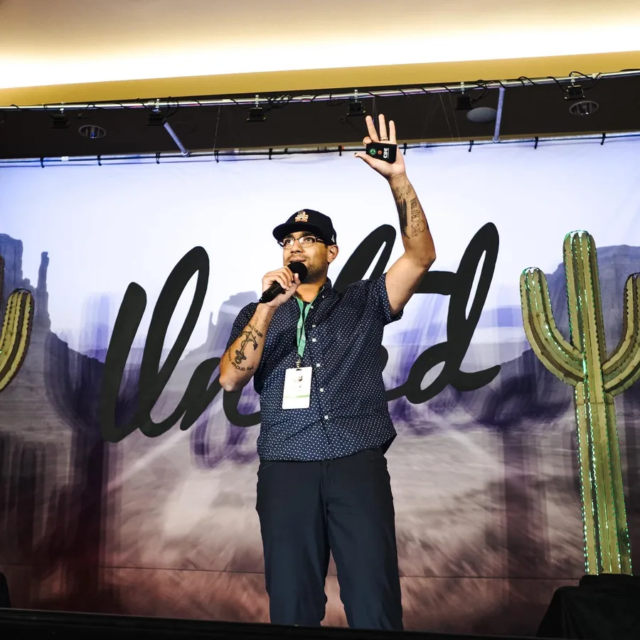 Devin speaking to a room of investors